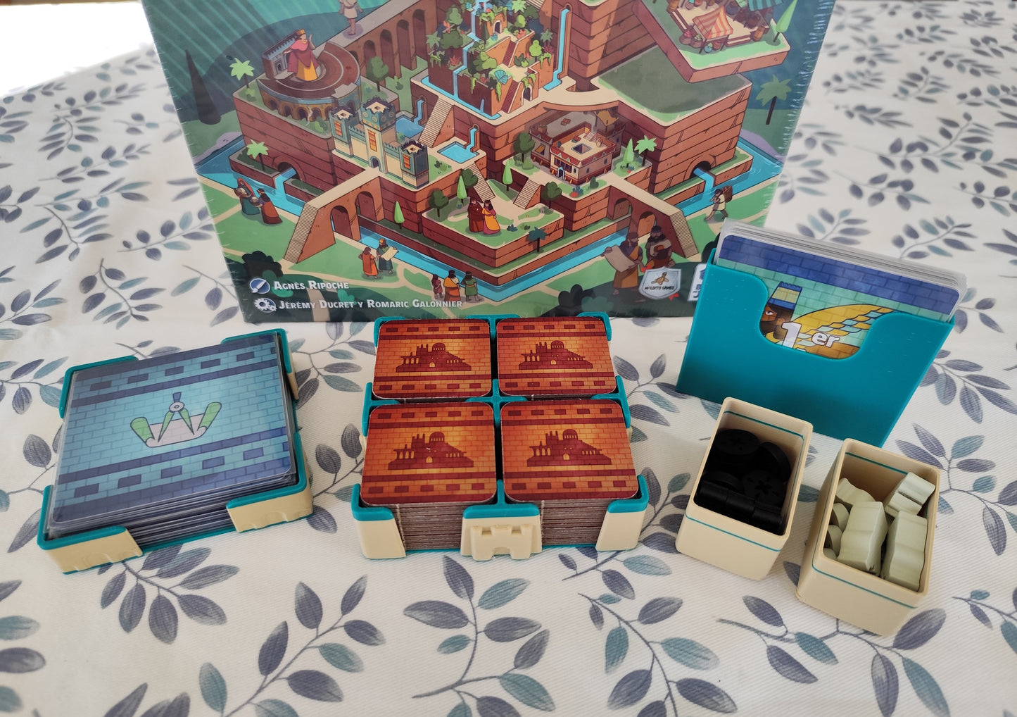 Board game organizer for The Architects of Amytis by KreativLayers, showcasing compartments and a sleek design.