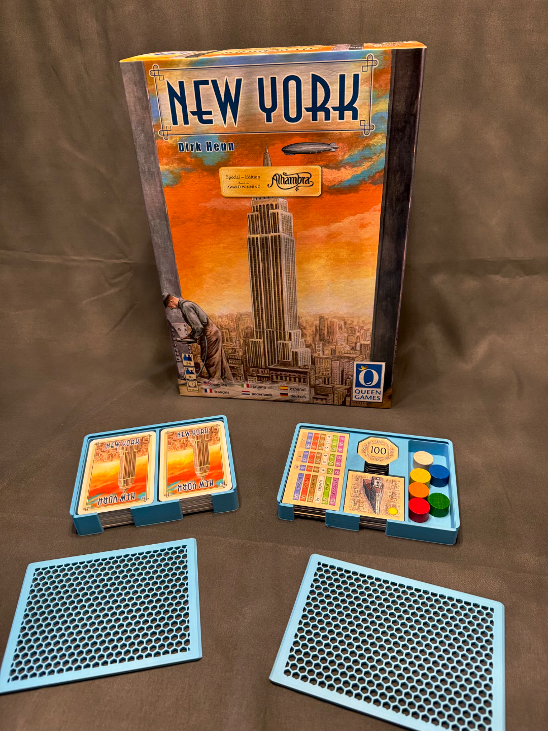 KreativLayers New York Insert, a board game organizer with compartments for cards and tokens, shown in a well-lit setting.