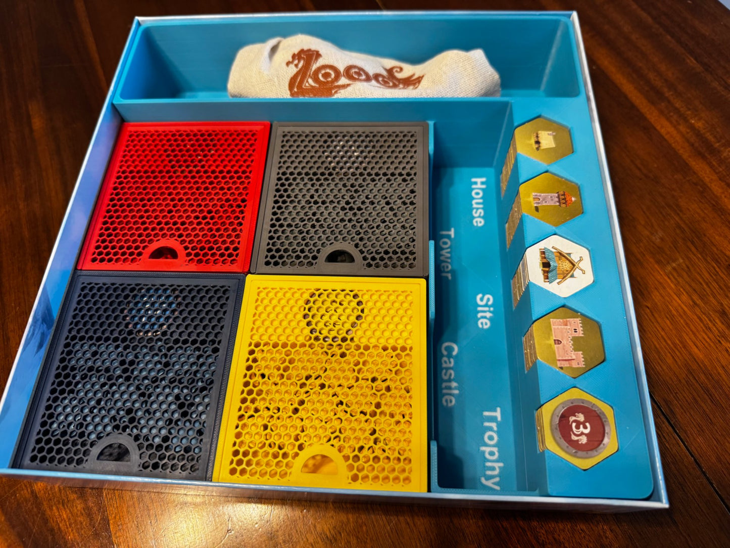 KreativLayers Looot Game Insert, a sturdy board game organizer with compartments for game pieces and cards.
