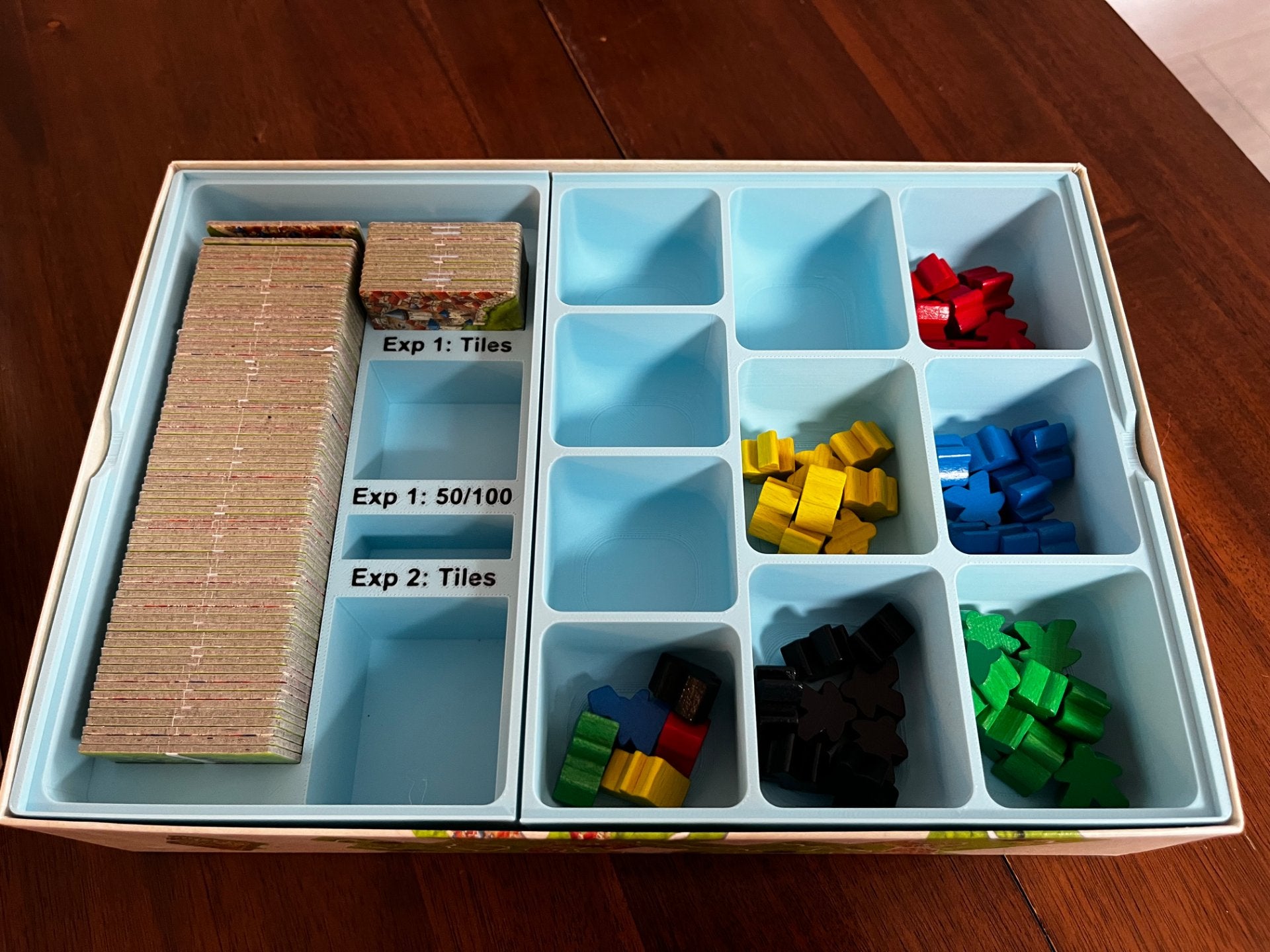 Carcassonne game insert by KreativLayers, featuring organized compartments for game pieces and tiles.