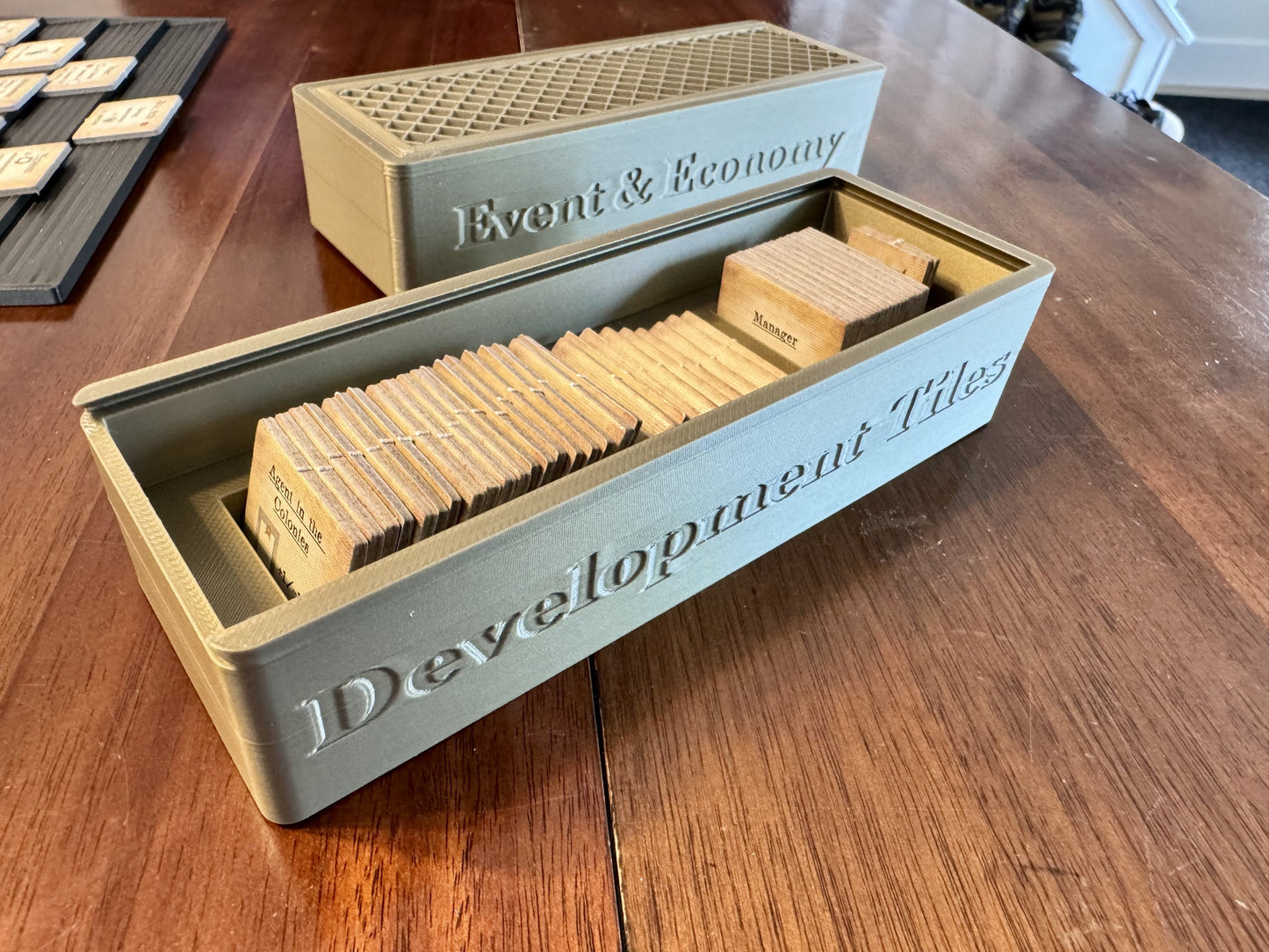 KreativLayers Arkwright Game Insert with worker overlay, featuring compartments for game components and organized layout.