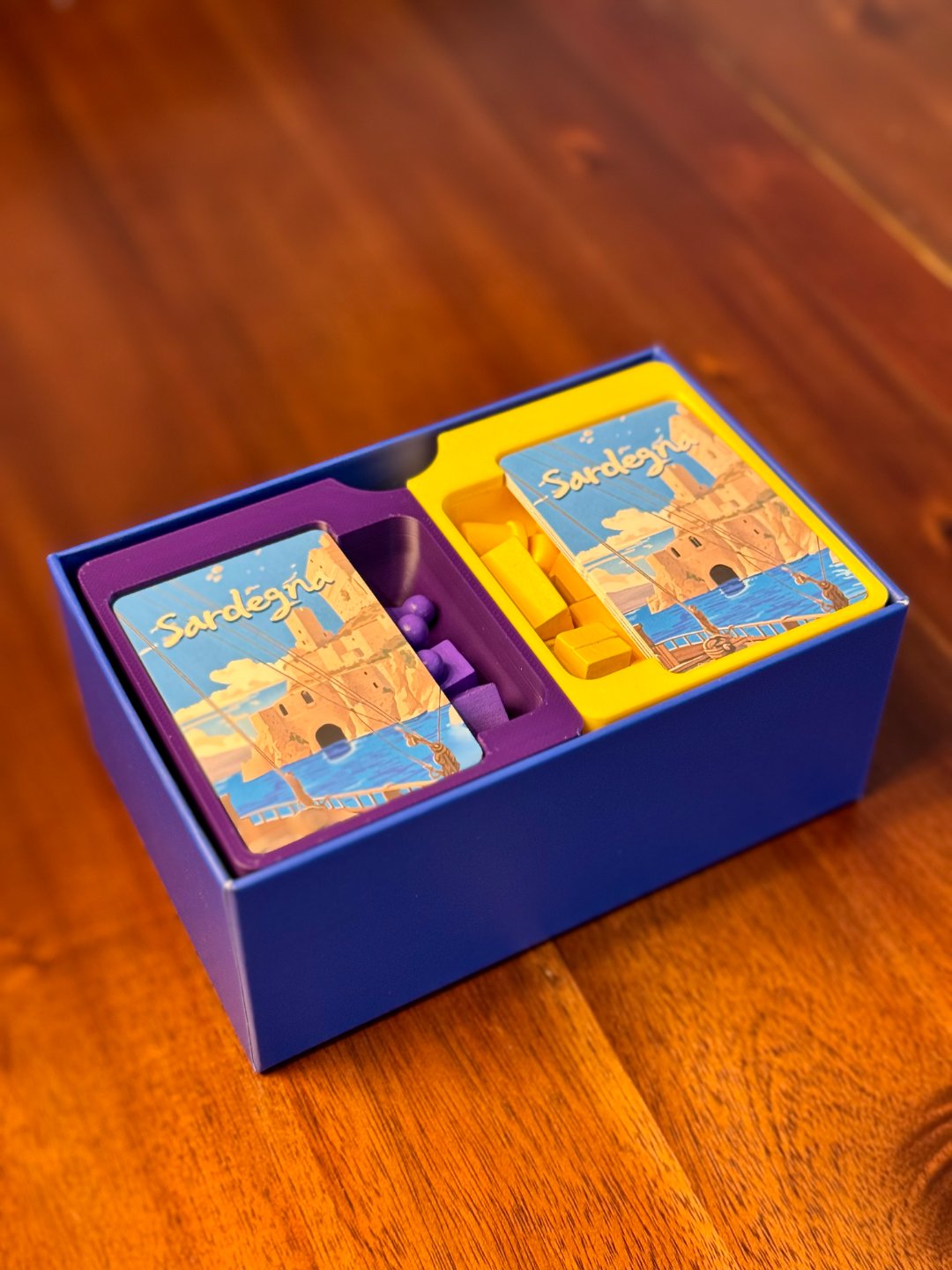 Sardegna board game organizer by KreativLayers, featuring custom compartments for game pieces and cards.