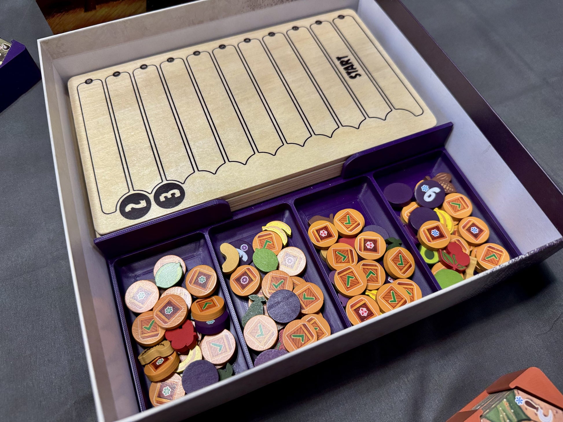 KreativLayers Click A Tree board game organizer with multiple compartments for game pieces and cards.