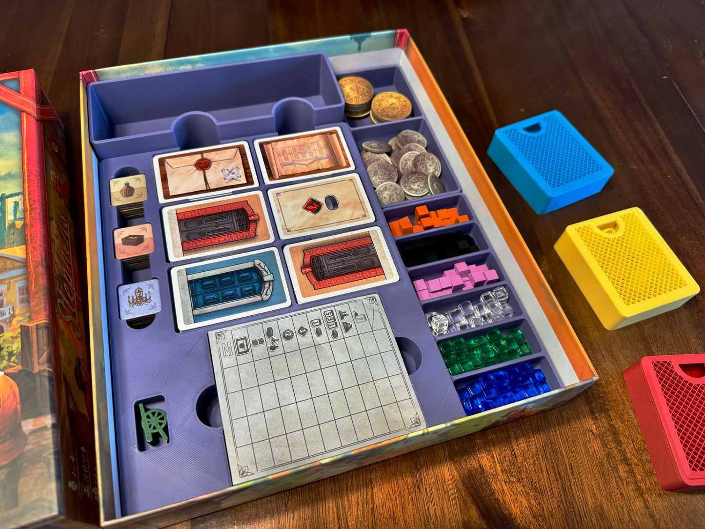 KreativLayers Board Game Organizer with compartments for game pieces and cards, designed for efficient storage.