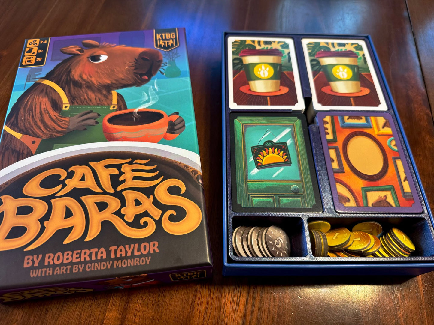 Cafe Baras board game organizer by KreativLayers, featuring custom compartments for game pieces and cards.