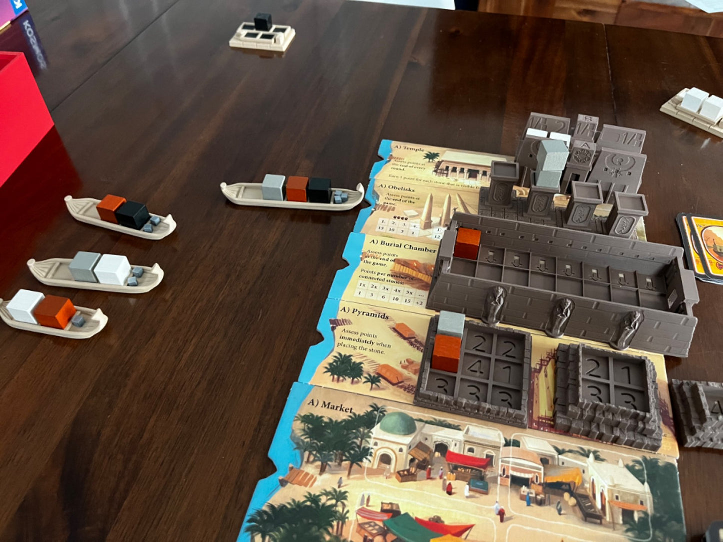 Imhotep board game organizer by KreativLayers with upgraded components for efficient game setup and storage.