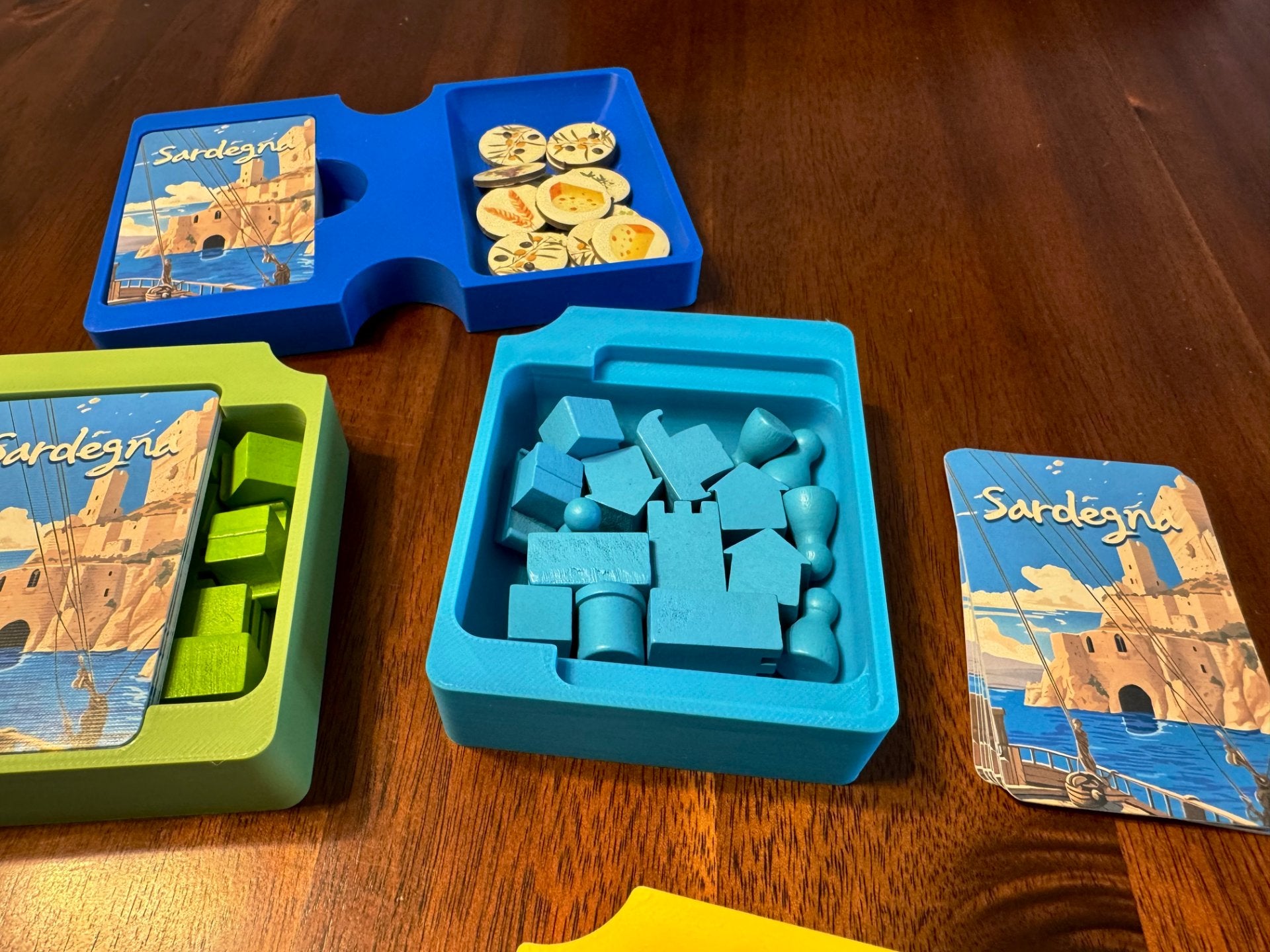 Sardegna board game organizer by KreativLayers, featuring custom compartments for game pieces and cards in a sleek design.