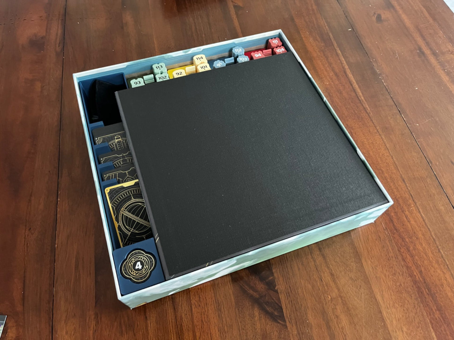 Skyrise Board Game Insert by KreativLayers, featuring compartments for game components and organized storage solution.