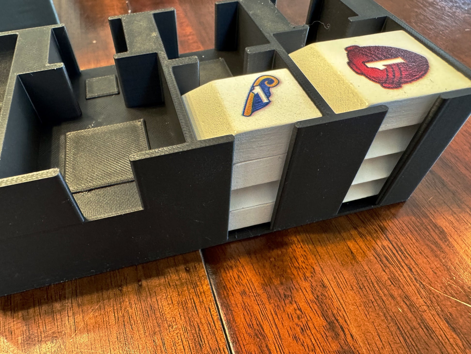 Men-Nefer Board Game Organizer by KreativLayers, featuring compartments for game pieces and cards in a stylish design.