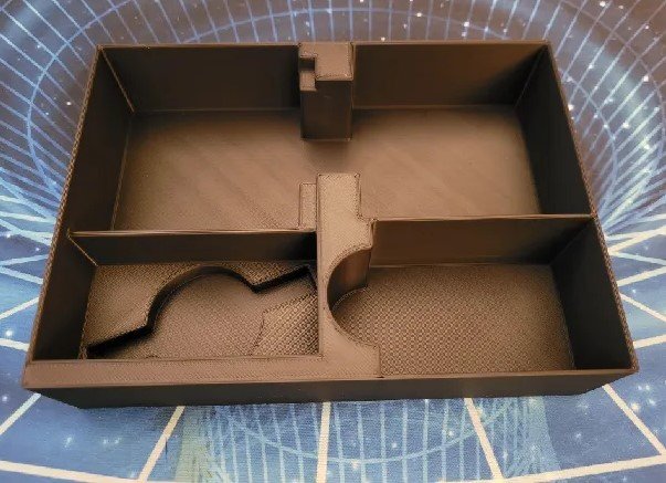 KreativLayers Faraway board game organizer with compartments for game pieces and cards, neatly arranged for easy access.