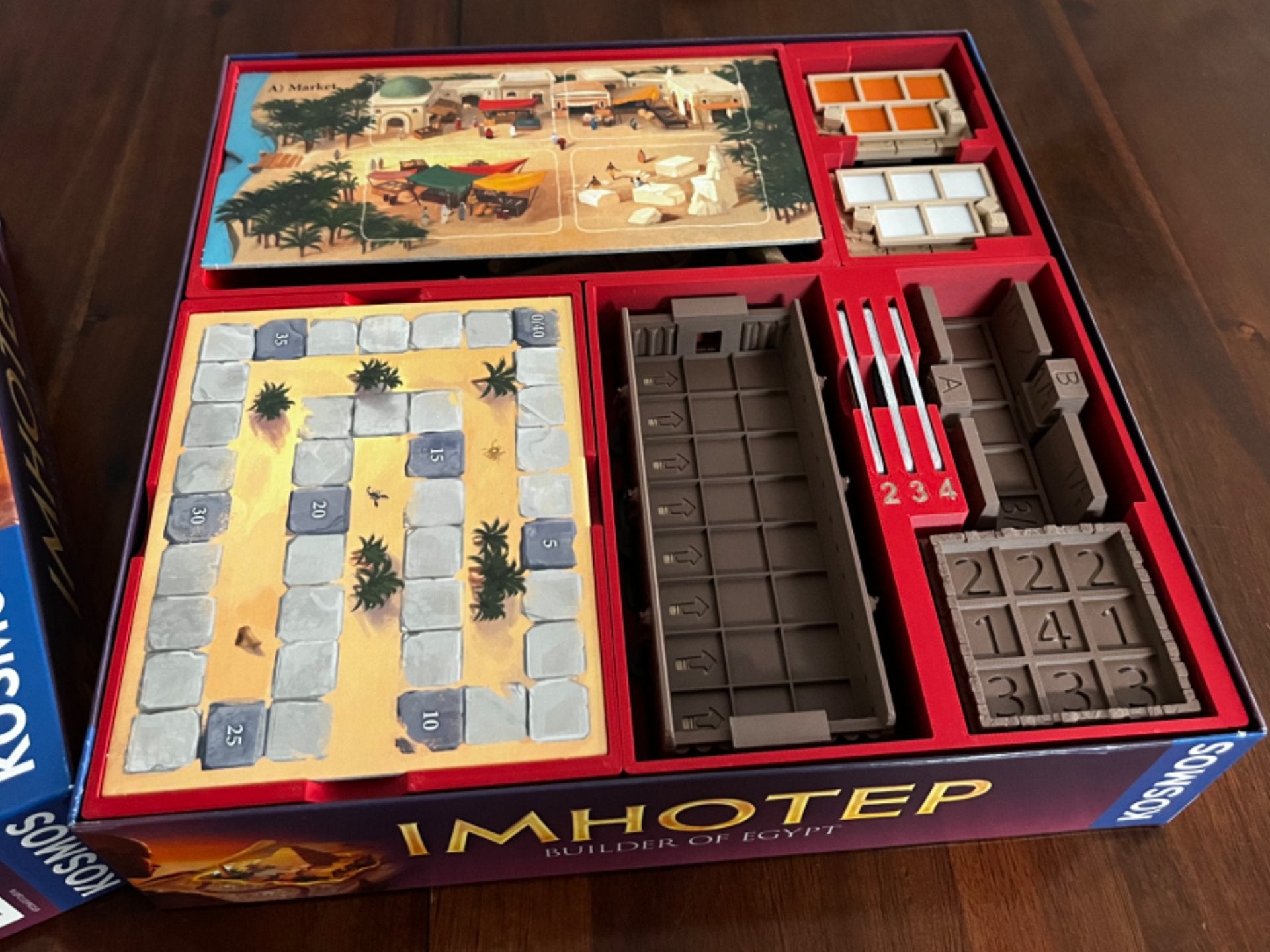 Imhotep board game organizer by KreativLayers with upgraded components for efficient game setup and storage.