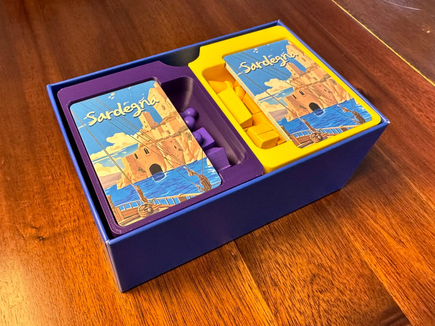 Sardegna board game organizer by KreativLayers, showcasing compartments for game pieces and cards in a sleek design.