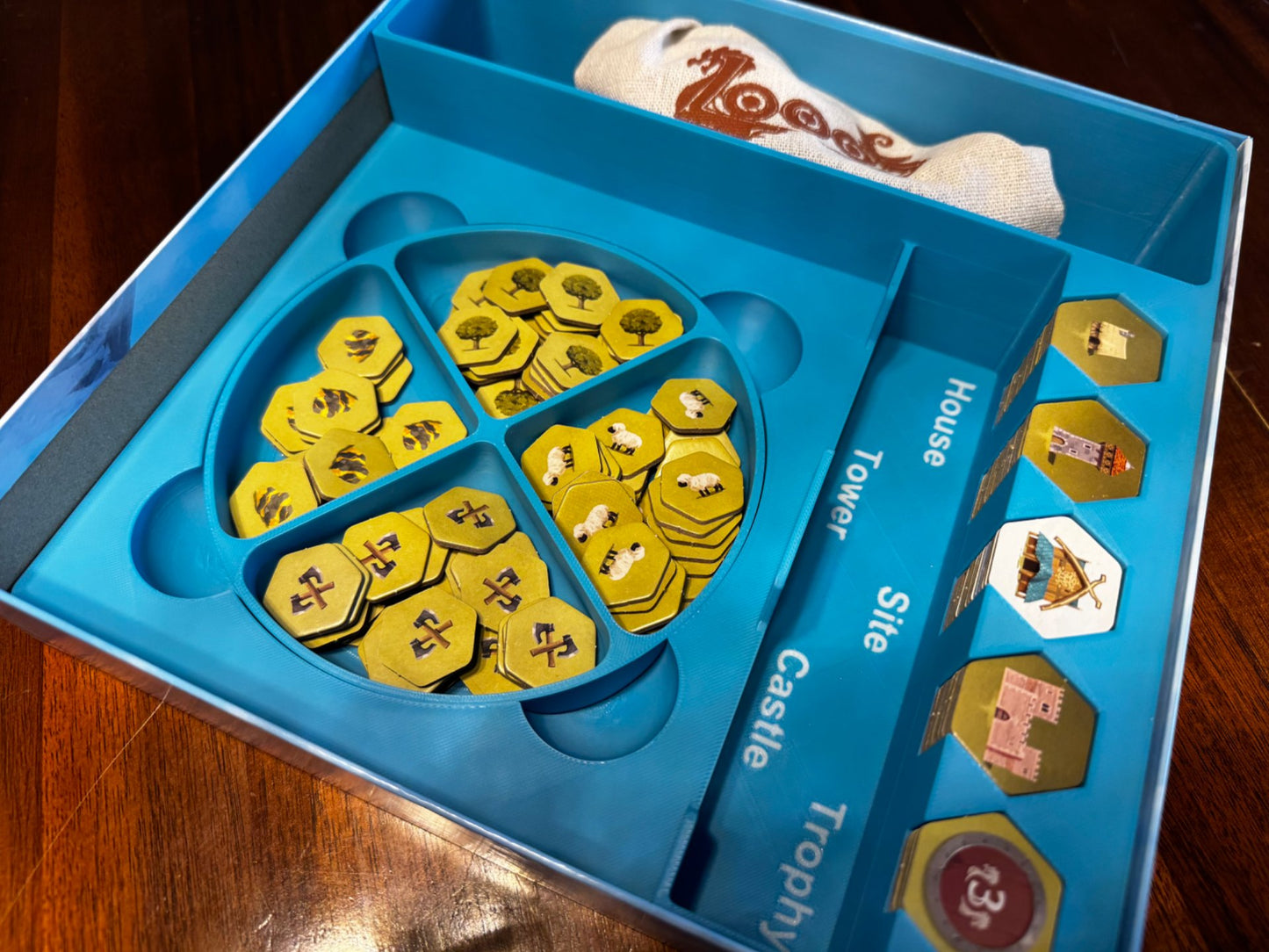 KreativLayers Looot Game Insert, a wooden board game organizer with compartments for game pieces and cards.