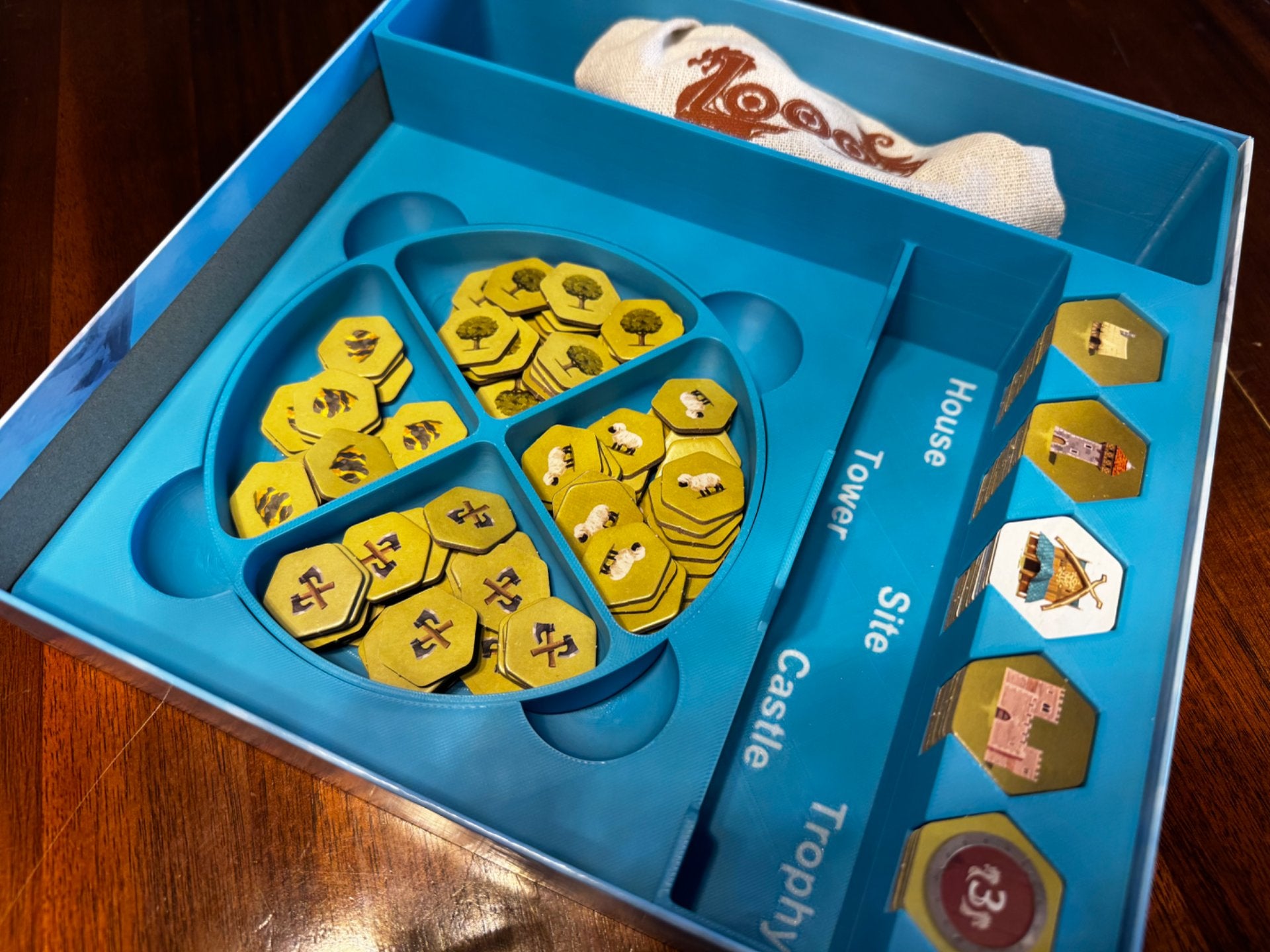 KreativLayers Looot Game Insert, a wooden board game organizer with compartments for game pieces and cards.