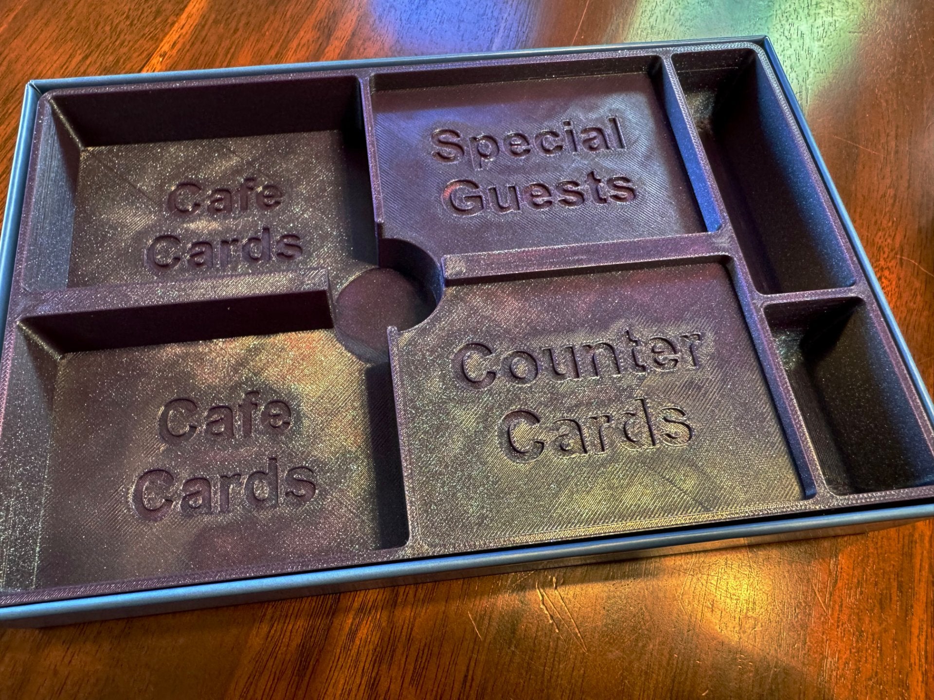 KreativLayers Cafe Baras board game organizer insert with compartments for game components and tokens.