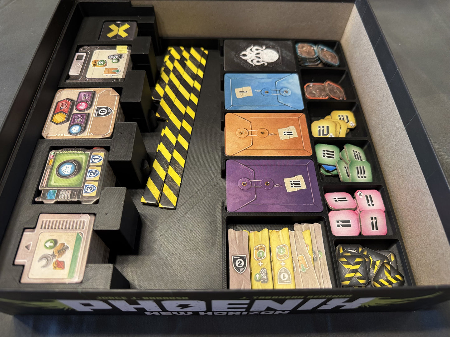 Phoenix New Horizon Board Game Organizer by KreativLayers, featuring custom compartments for game pieces and cards.