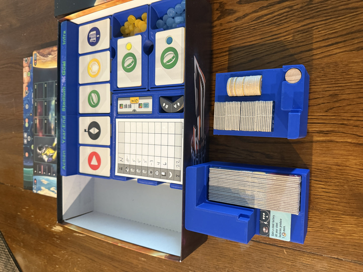 KreativLayers Evacuation Game Insert, a board game organizer with compartments for cards and tokens, shown in use.