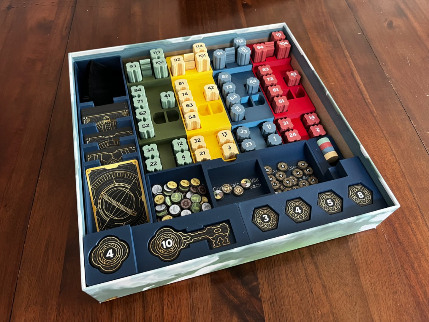 Skyrise Board Game Insert by KreativLayers, featuring custom compartments for game pieces and cards in a sleek design.