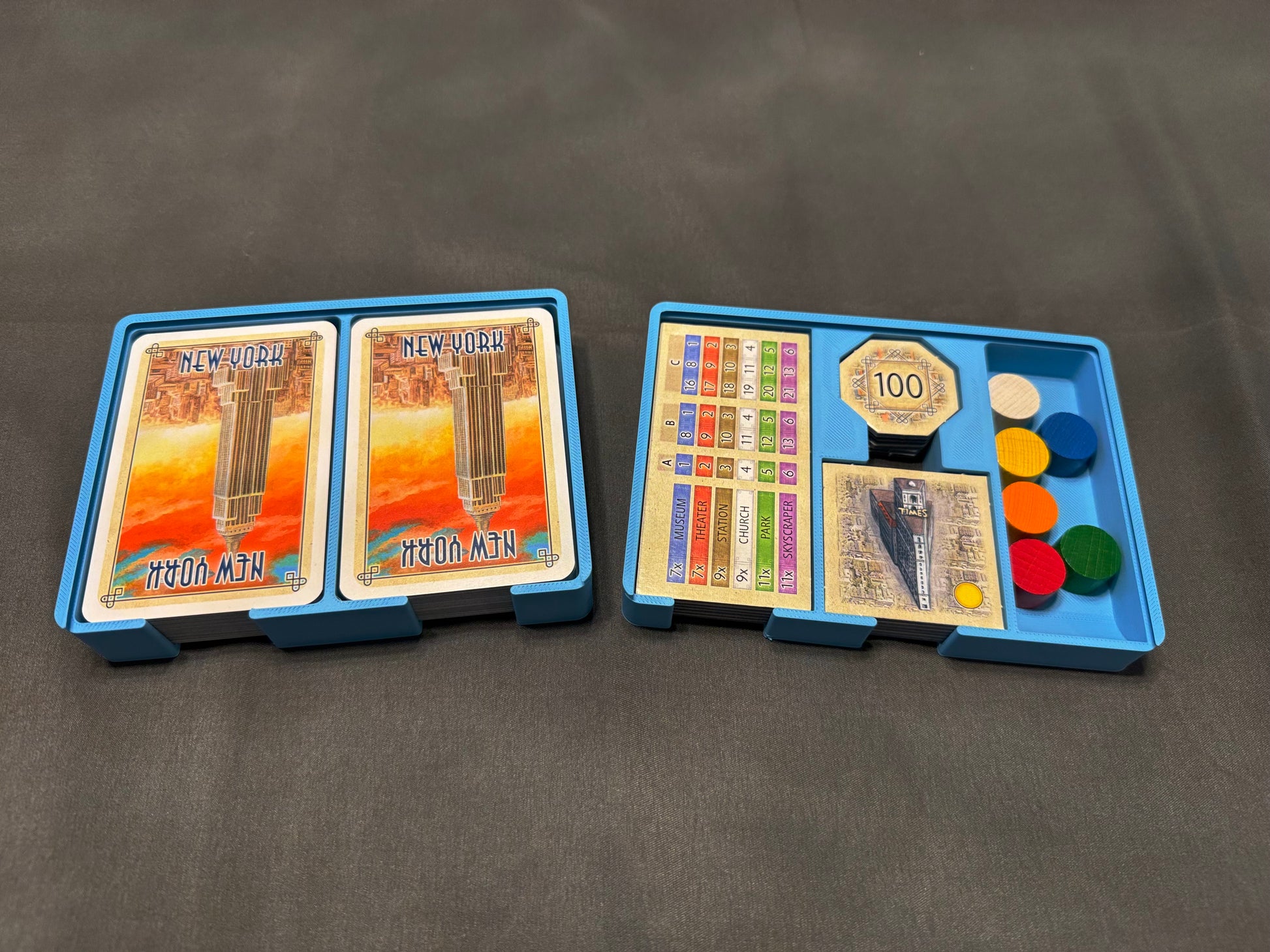 KreativLayers New York board game organizer with multiple compartments and inserts for game pieces and cards.