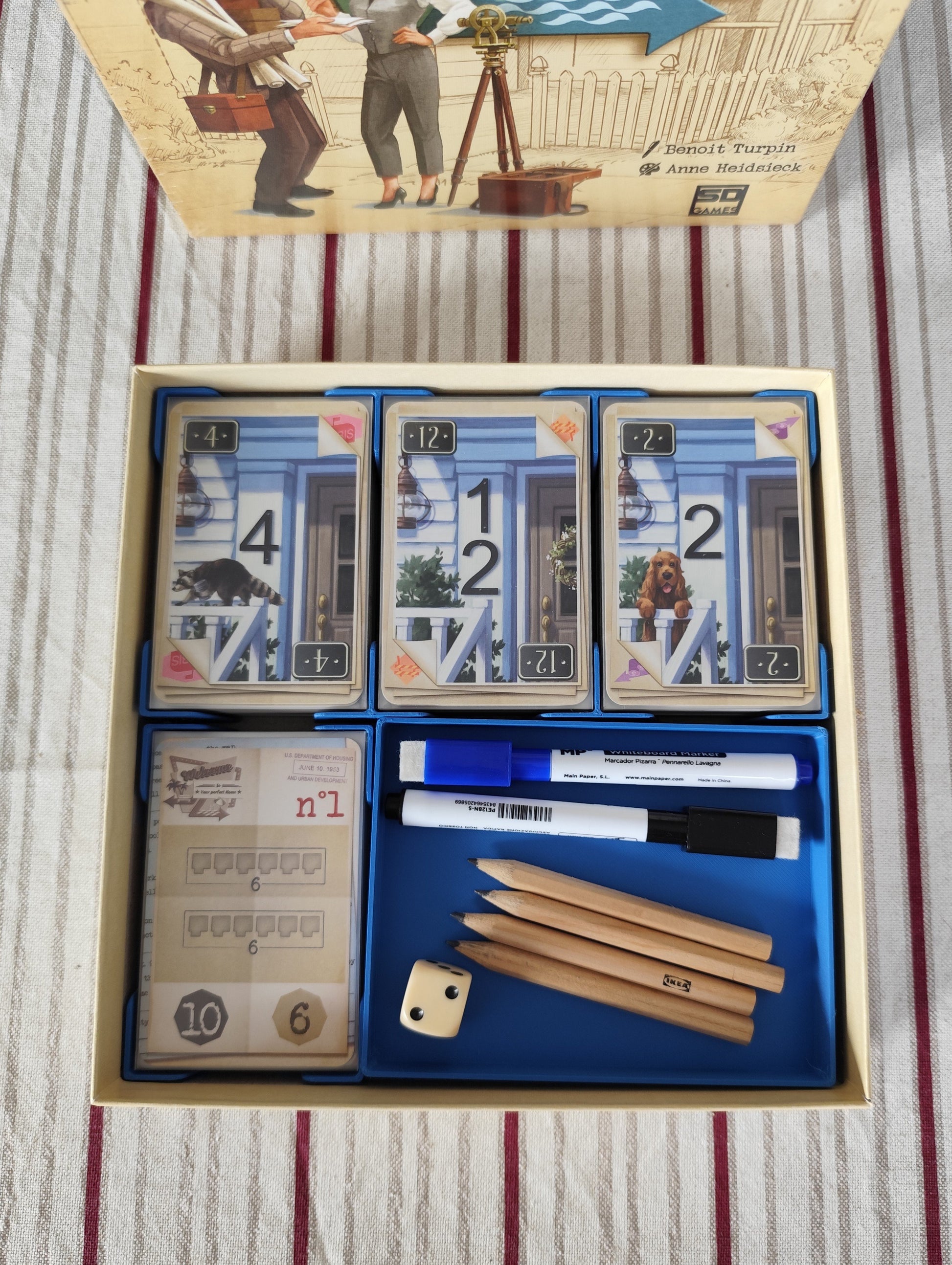 KreativLayers Welcome To INSERT board game organizer with compartments for cards and game pieces, showcasing its design.