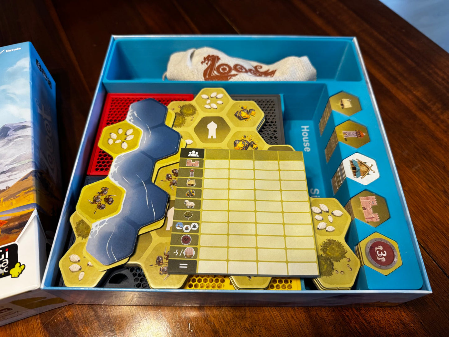 KreativLayers Looot Game Insert, a sturdy board game organizer with compartments for game pieces and cards.