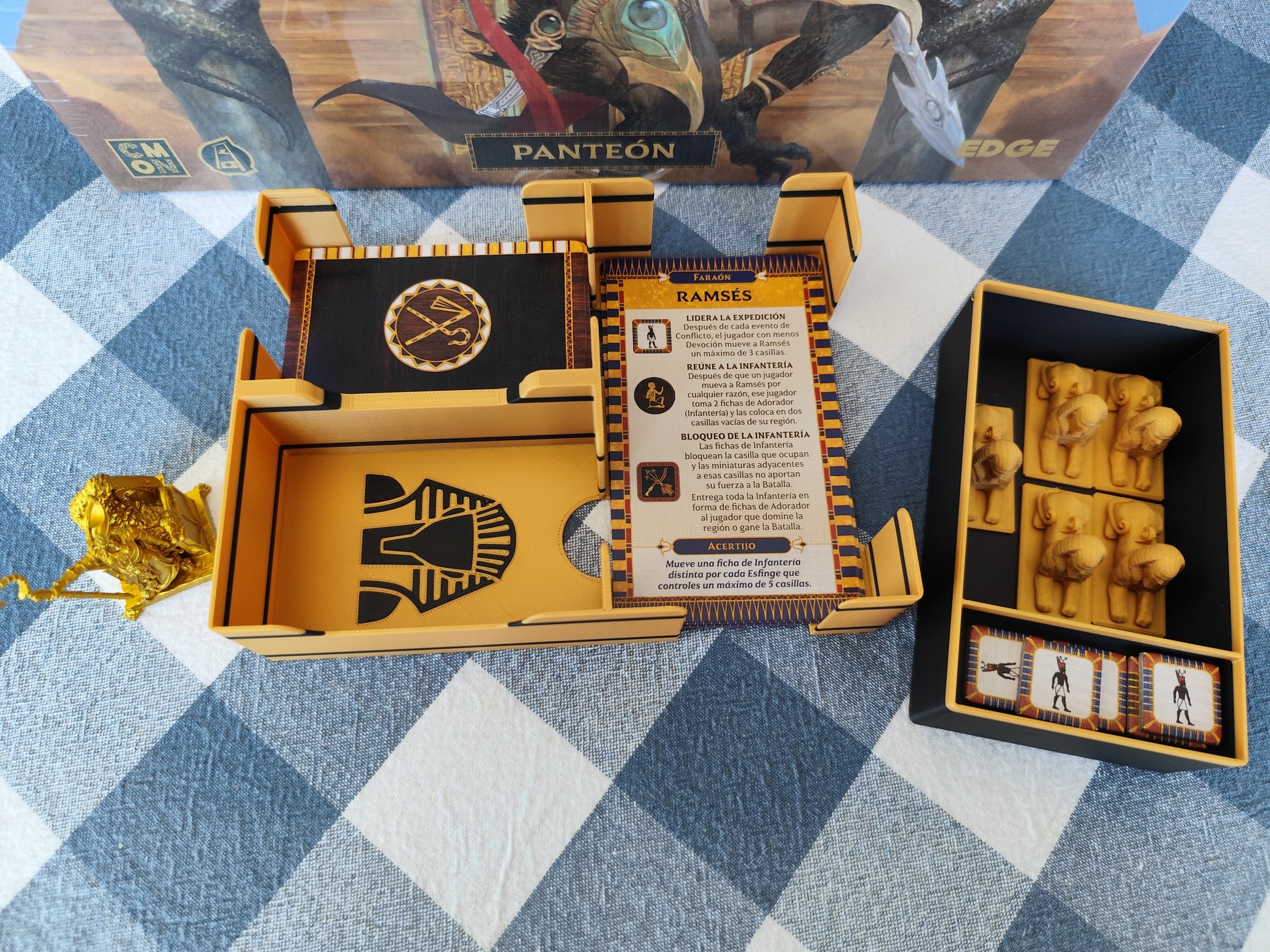 KreativLayers Ankh Gods of Egypt board game organizer with compartments for cards and game pieces displayed on a table.