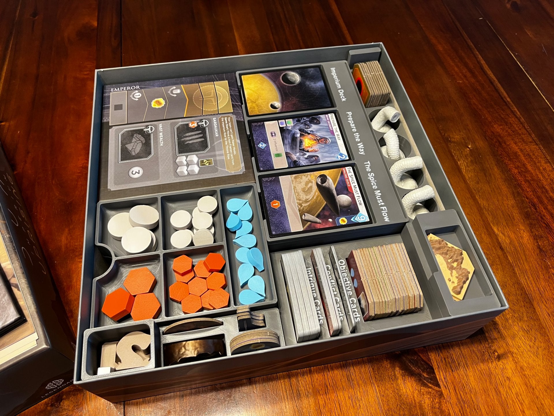 Dune Imperium Uprising board game organizer by KreativLayers, featuring custom compartments for game components.