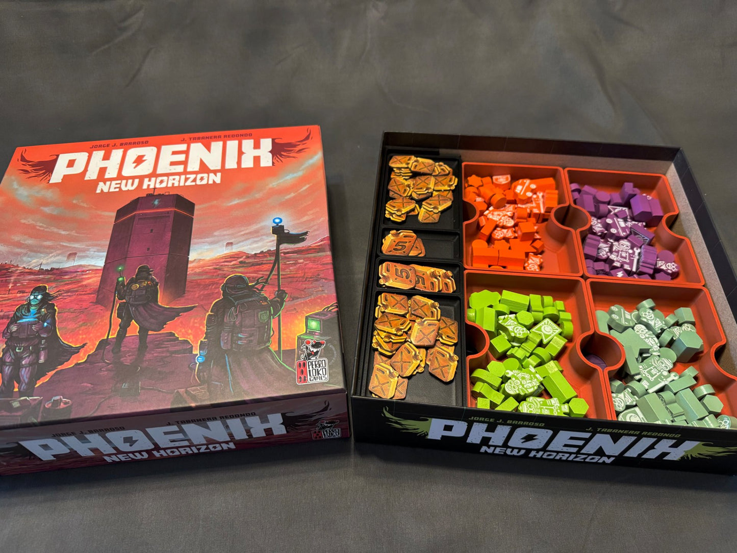 Phoenix New Horizon board game organizer by KreativLayers, featuring compartments for game components and cards.