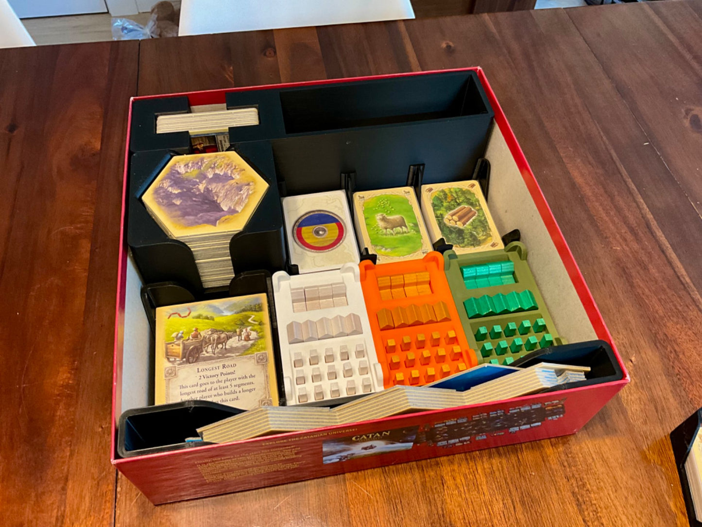 Catan 25th Anniversary Edition Organizer by KreativLayers with compartments for game pieces and cards in a stylish design.