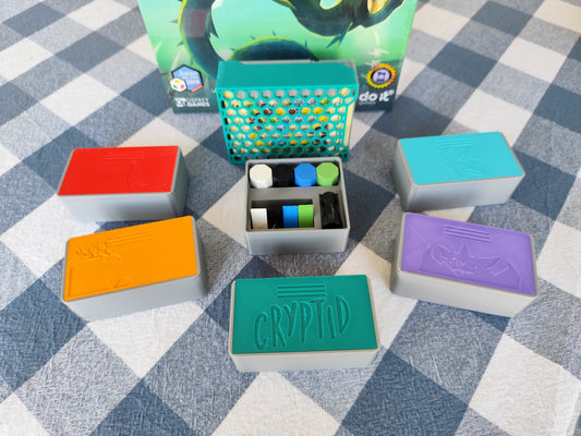 Board game organizer for Cryptid by KreativLayers, featuring compartments for game components and a sleek design.