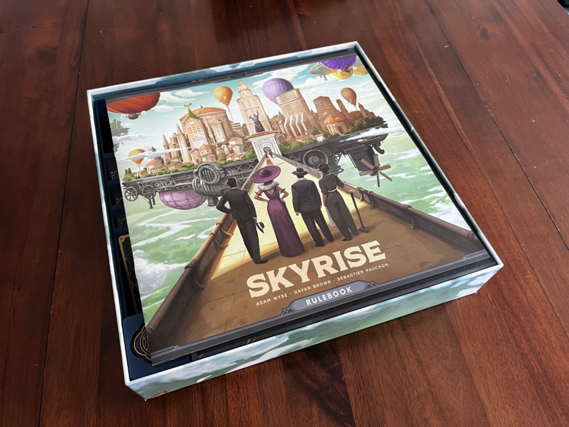 Skyrise Board Game Insert by KreativLayers, featuring compartments for organized game pieces and cards.