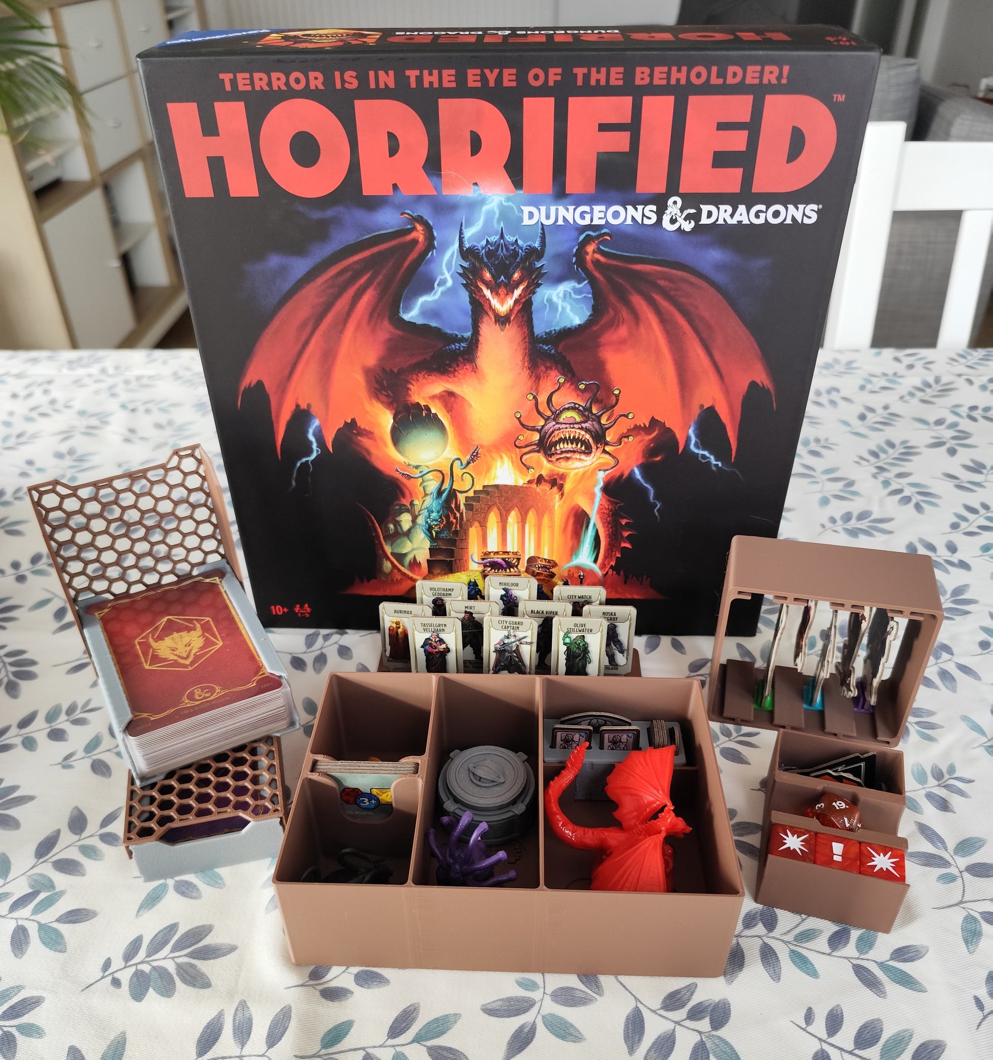 KreativLayers Horrified Dungeons & Dragons board game organizer with compartments for game pieces and cards.