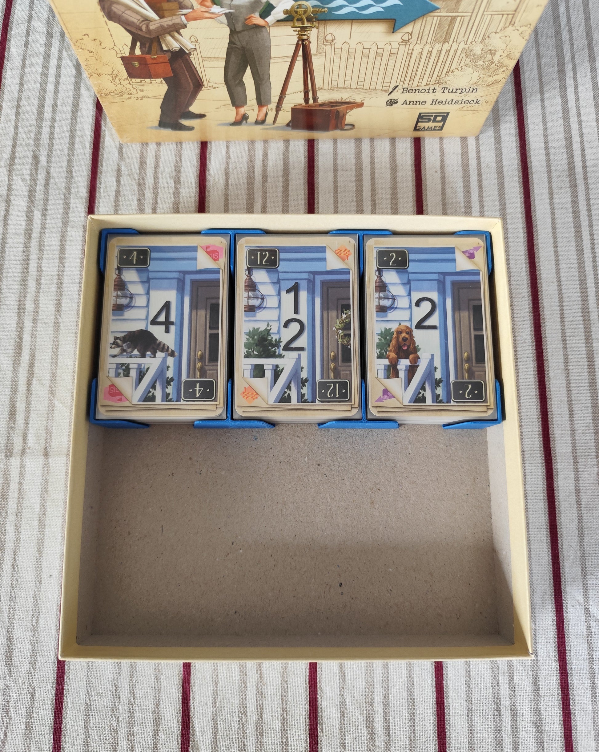 KreativLayers Welcome To INSERT board game organizer with compartments for game pieces and cards.