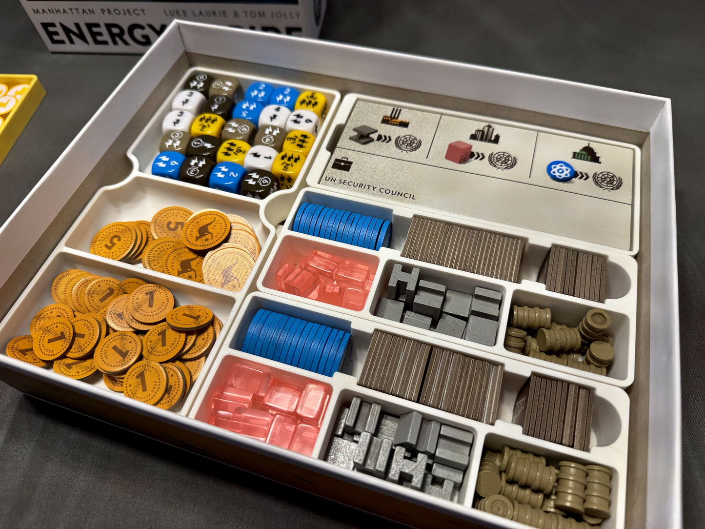 Manhattan Project Energy Empire board game organizer by KreativLayers, featuring compartments for game components and cards.