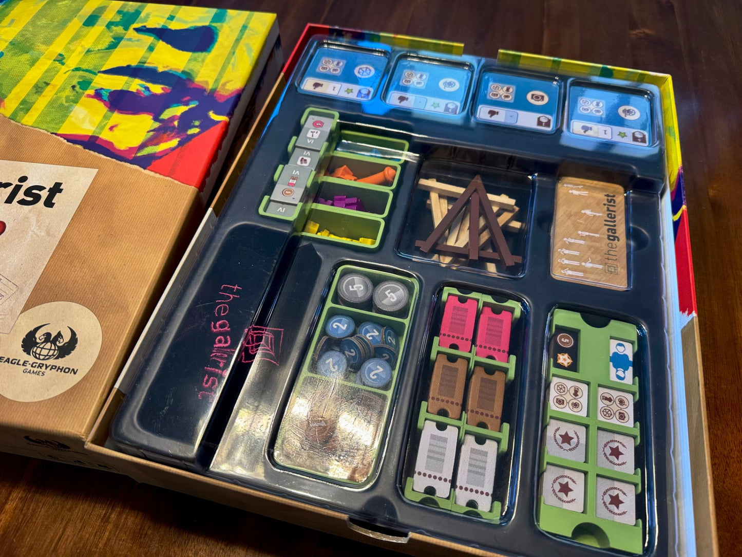 The Gallerist Organizer by KreativLayers, featuring compartments for board game components and cards, shown from above.