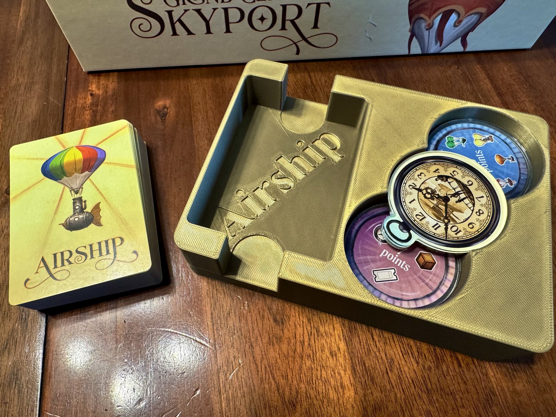Grand Central Skyport Deluxe Organizer by KreativLayers, featuring compartments for board game pieces and accessories.