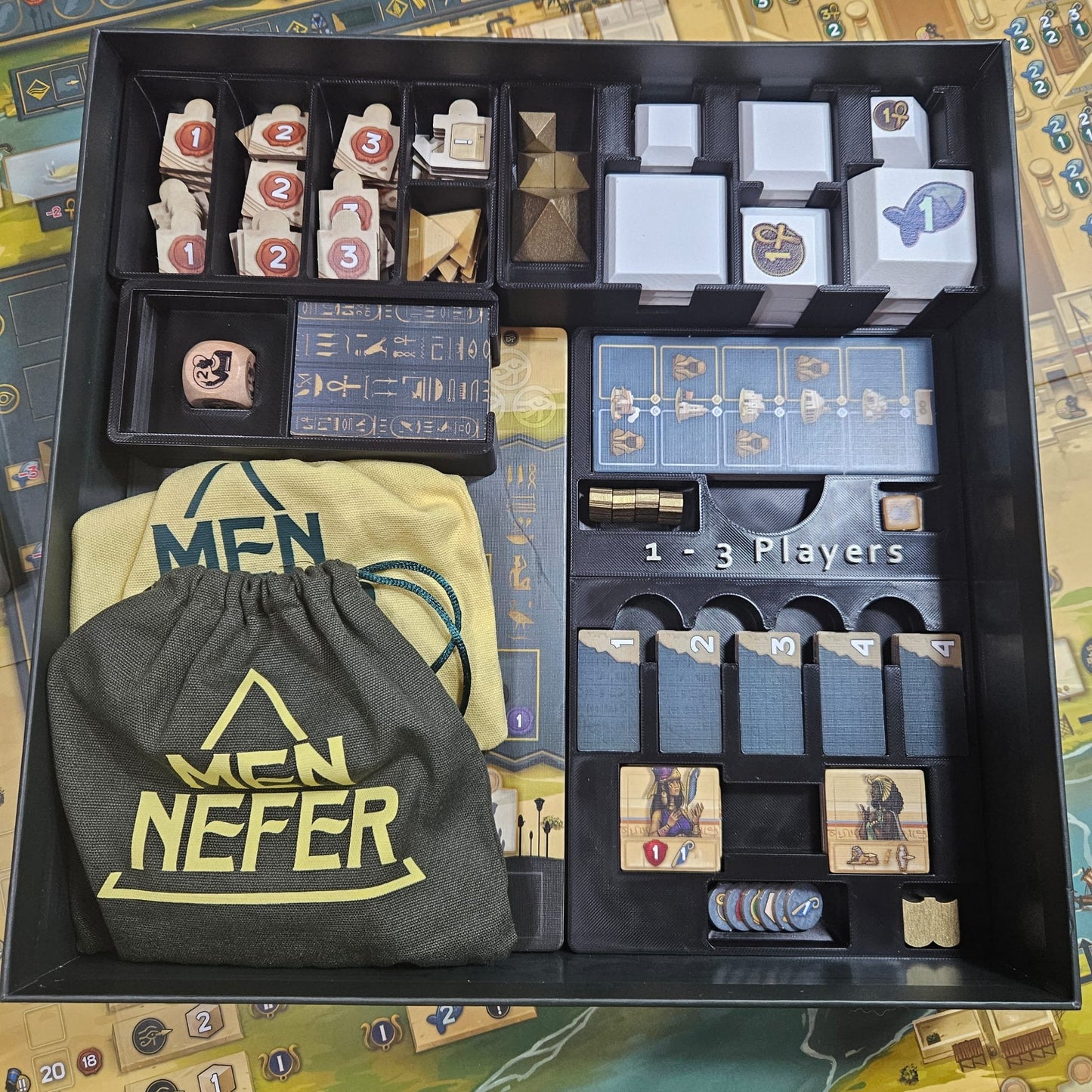 Men-Nefer board game organizer by KreativLayers featuring compartments for game pieces and cards.