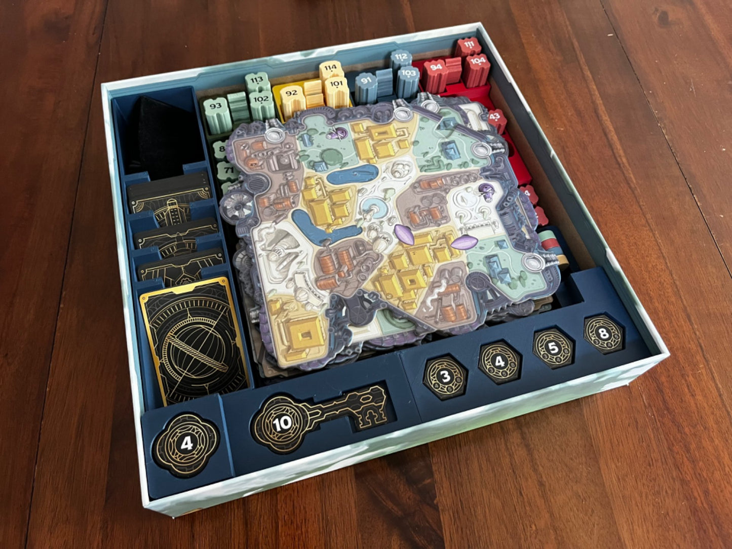 Skyrise Board Game Insert by KreativLayers, featuring compartments for game pieces and cards in a sleek design.
