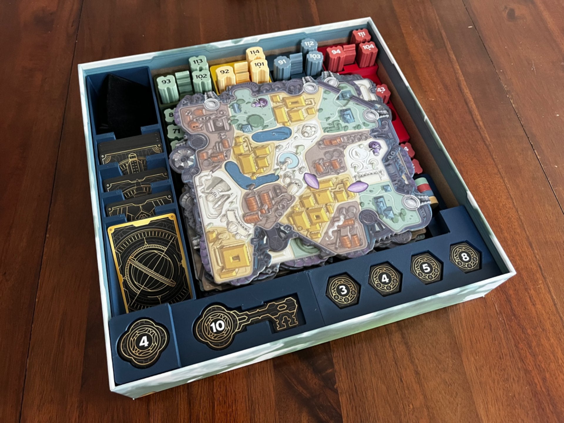 Skyrise Board Game Insert by KreativLayers, featuring compartments for game pieces and cards in a sleek design.