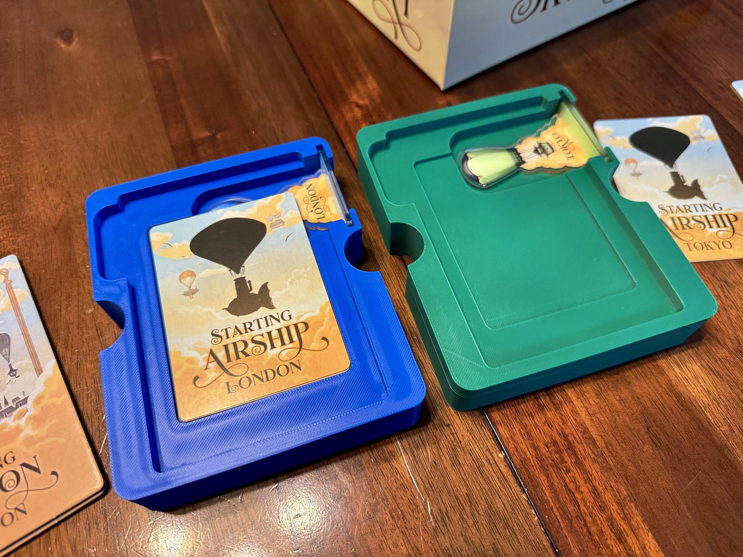 Grand Central Skyport Deluxe Board Game Organizer by KreativLayers with compartments for game components and cards.