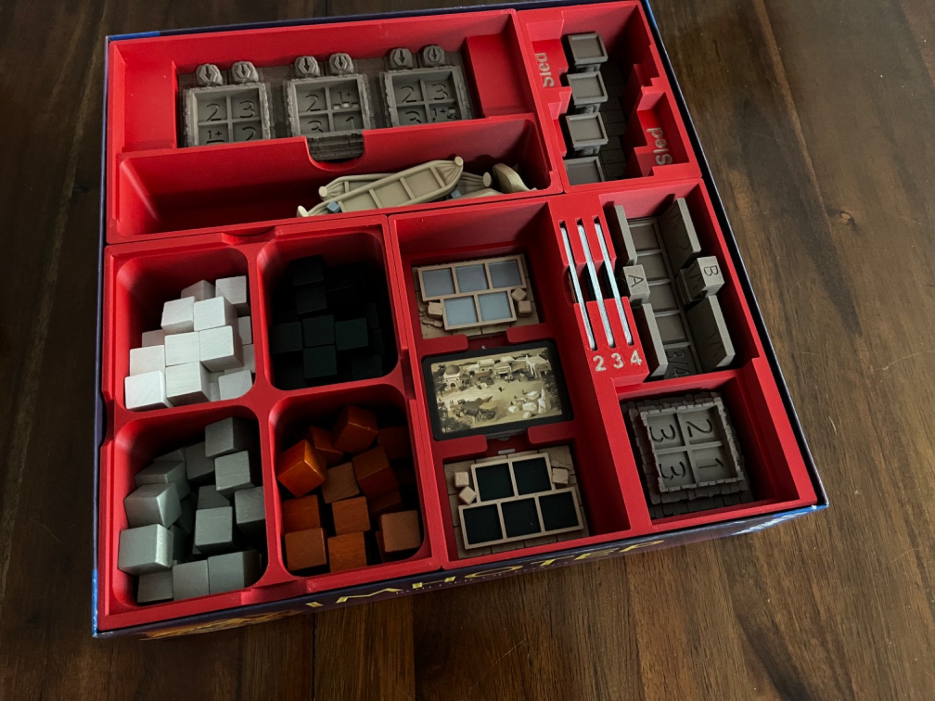 Imhotep Insert by KreativLayers, featuring upgraded components, neatly organizes board game pieces in a stylish design.