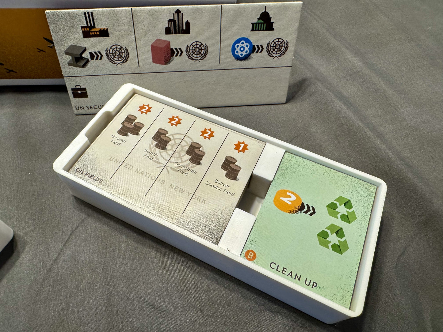 Manhattan Project Energy Empire organizer by KreativLayers, featuring compartments for game pieces and cards.