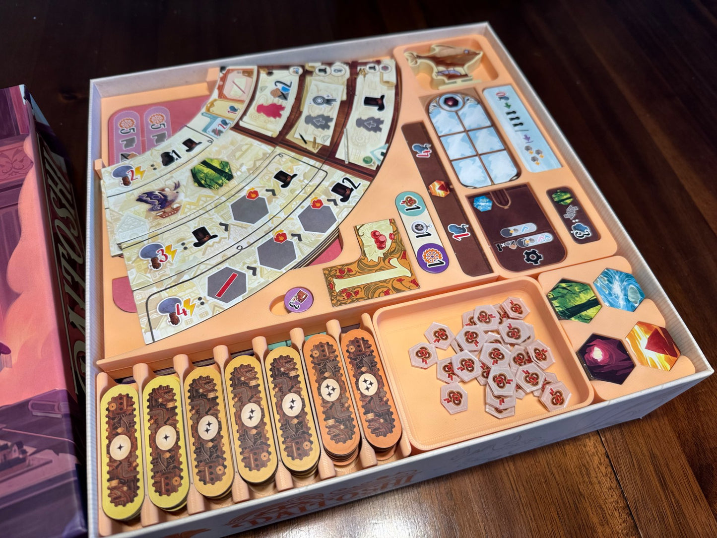 Daitoshi Board Game Organizer by KreativLayers featuring a no lid lift design with compartments for game components.