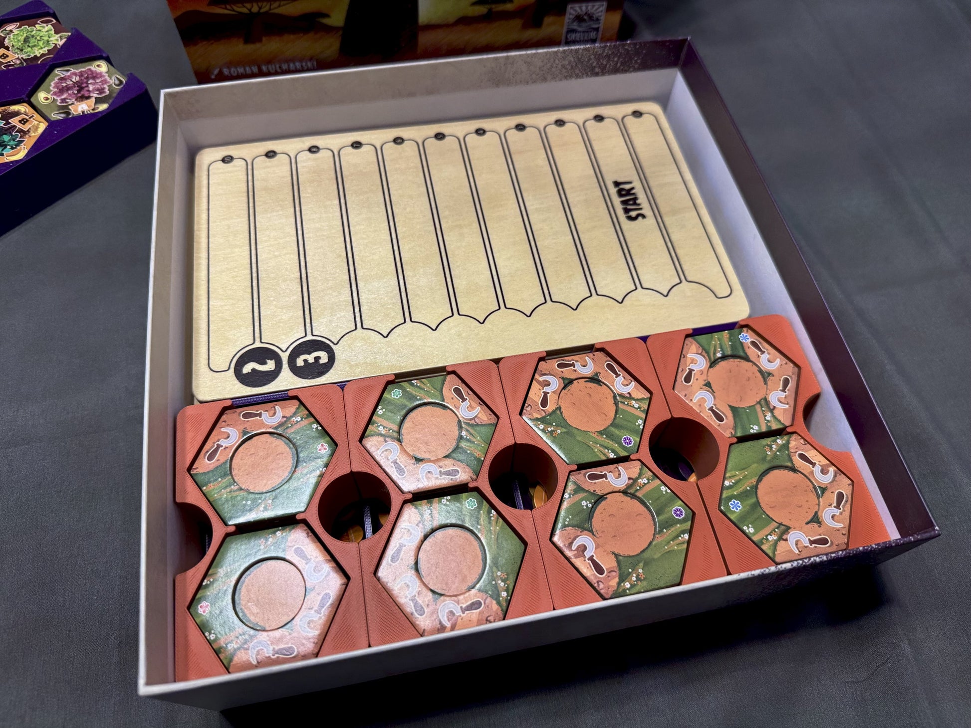 KreativLayers Click A Tree board game organizer with compartments for game pieces and cards.