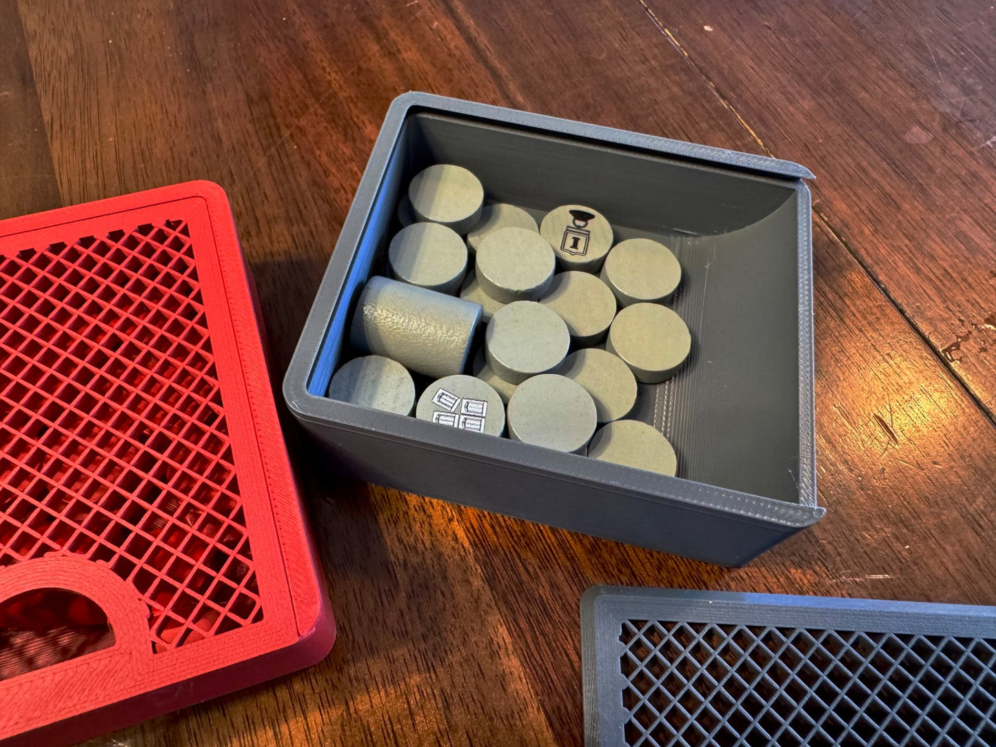KreativLayers board game organizer insert with compartments for game pieces and cards, enhancing game storage and accessibility.