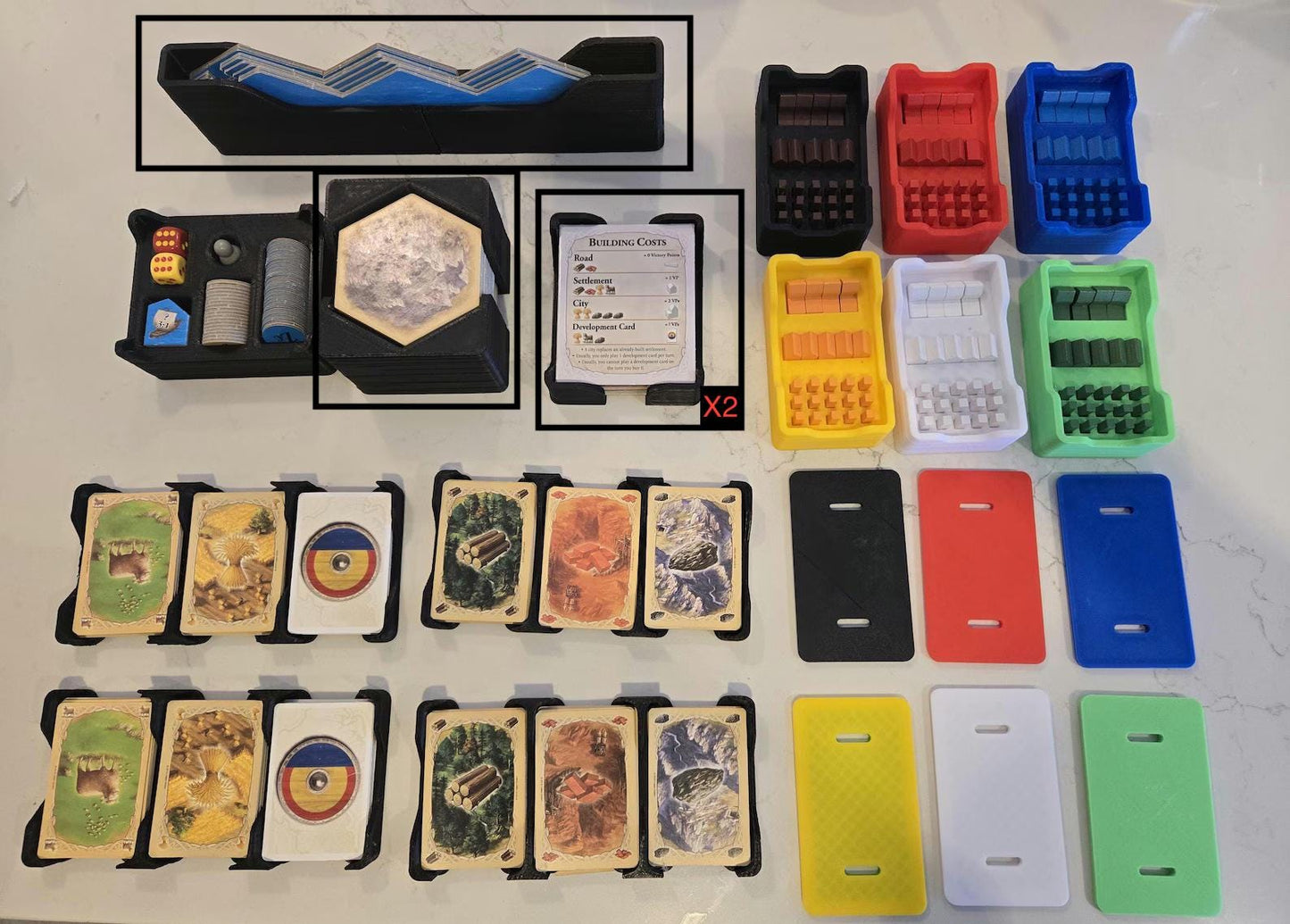 KreativLayers 3D printed board game organizer with card holders and colorful component trays.