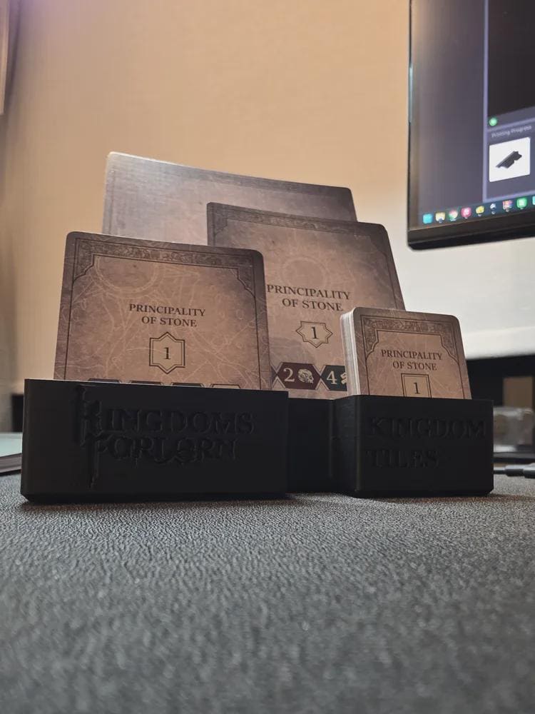 3D printed Kingdoms Forlorn board game organizer holding Principality of Stone cards on desk