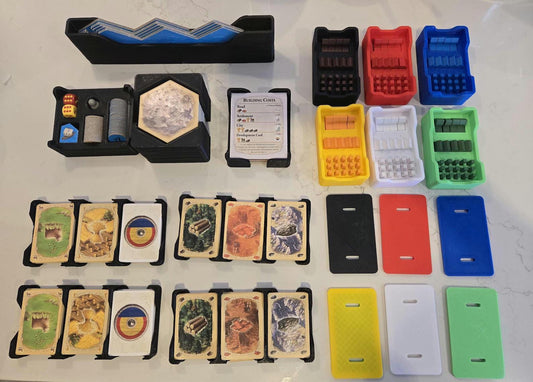 KreativLayers 3D printed board game organizer with color-coded boxes, card holders, and game components neatly arranged.