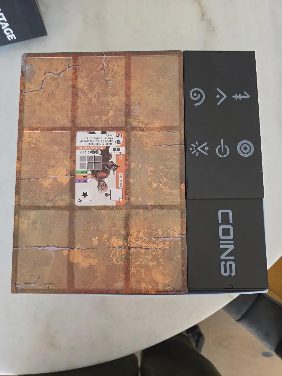 Board game organizer with rust-themed insert, labeled coin storage, and game card, KreativLayers