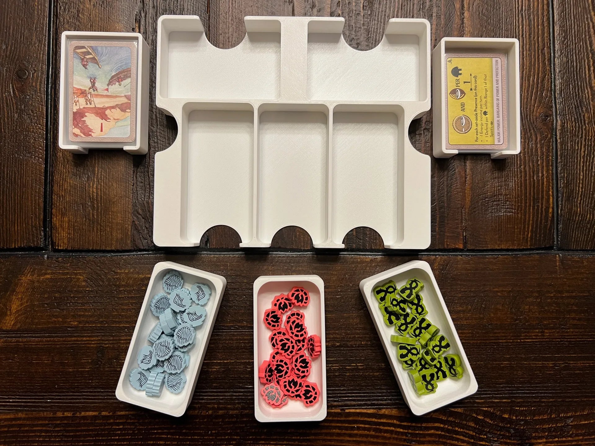 3D printed board game organizer with card and token trays on wooden table, KreativLayers